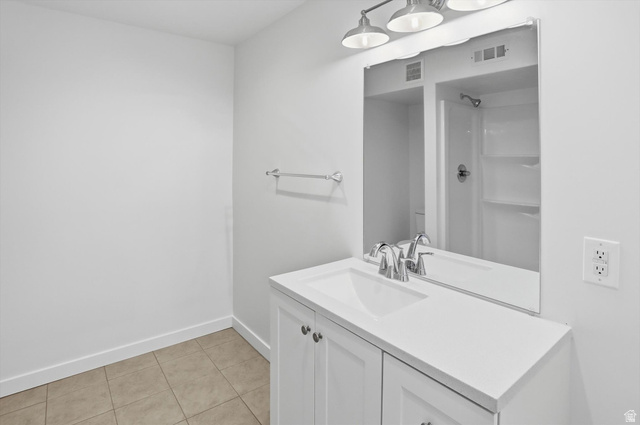 3636 West 910 South Syracuse, UT 84075 - Photo 23 of 70 Bathroom featuring a contemporary vanity with white cabinetry, a single basin sink, and a white countertop