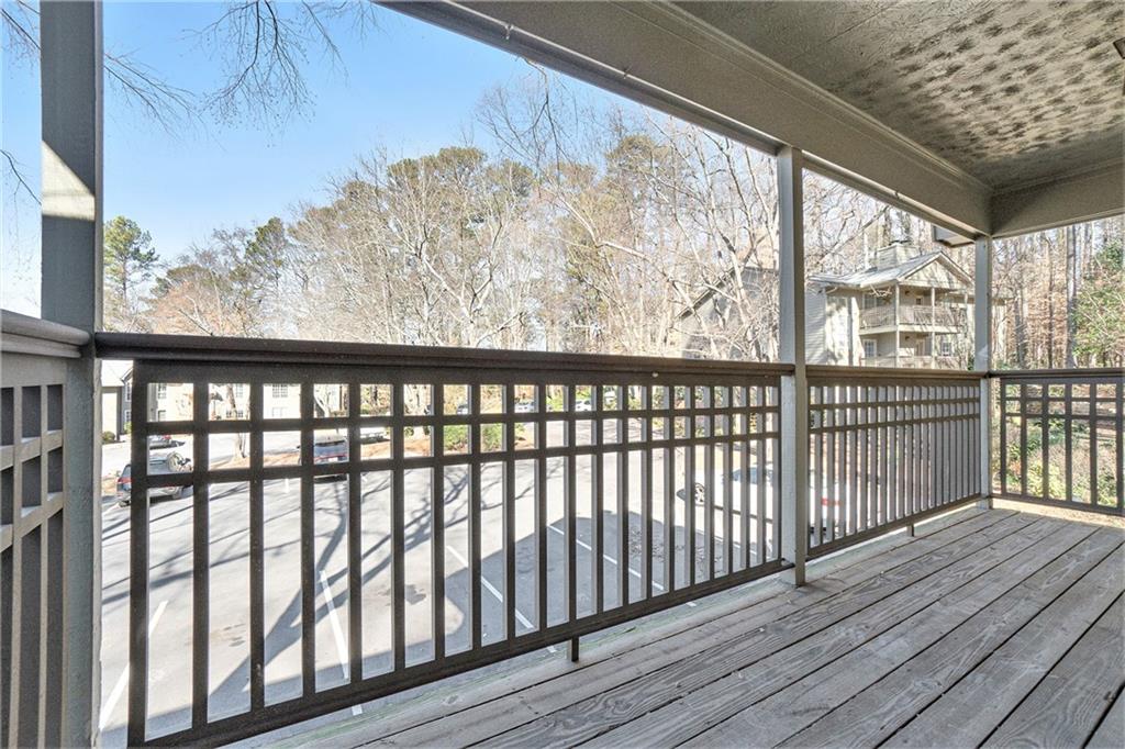 2901 Lenox Road Northeast, Unit 901 Atlanta, GA 30324 - Photo 15 of 18 a view of a porch with wooden floor