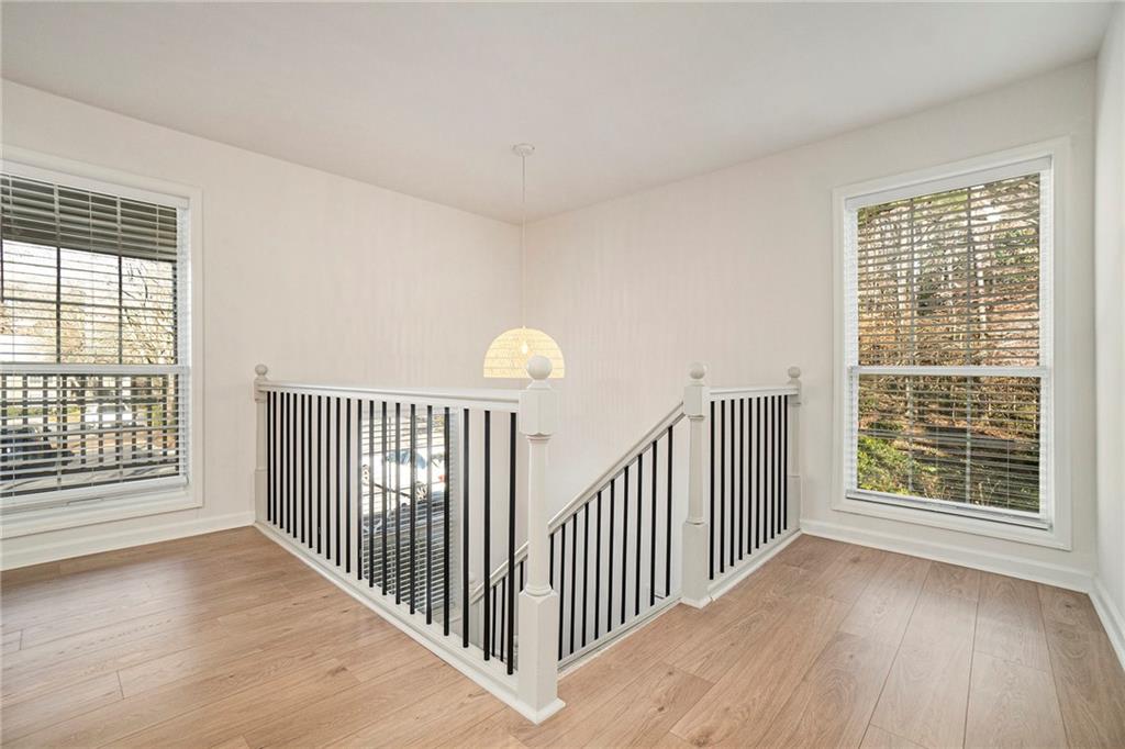 2901 Lenox Road Northeast, Unit 901 Atlanta, GA 30324 - Photo 5 of 18 a view of a room with wooden floor and windows