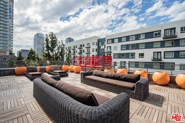 a outdoor living space with furniture and city view