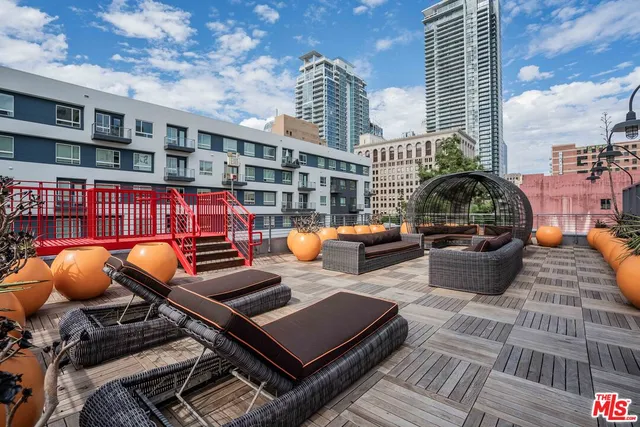 a front view of a building with sitting area