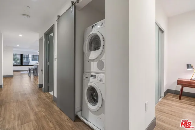 a view of a hallway with washer and dryer