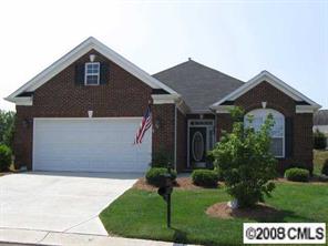 1033 Peridot Court Fort Mill, SC 29708 - Photo 1 of 8 a front view of a house with a yard and garage