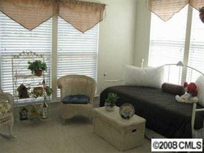 1033 Peridot Court Fort Mill, SC 29708 - Photo 5 of 8 a bedroom with furniture and a window