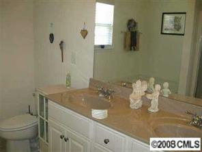 1033 Peridot Court Fort Mill, SC 29708 - Photo 7 of 8 a bathroom with a sink a toilet and mirror