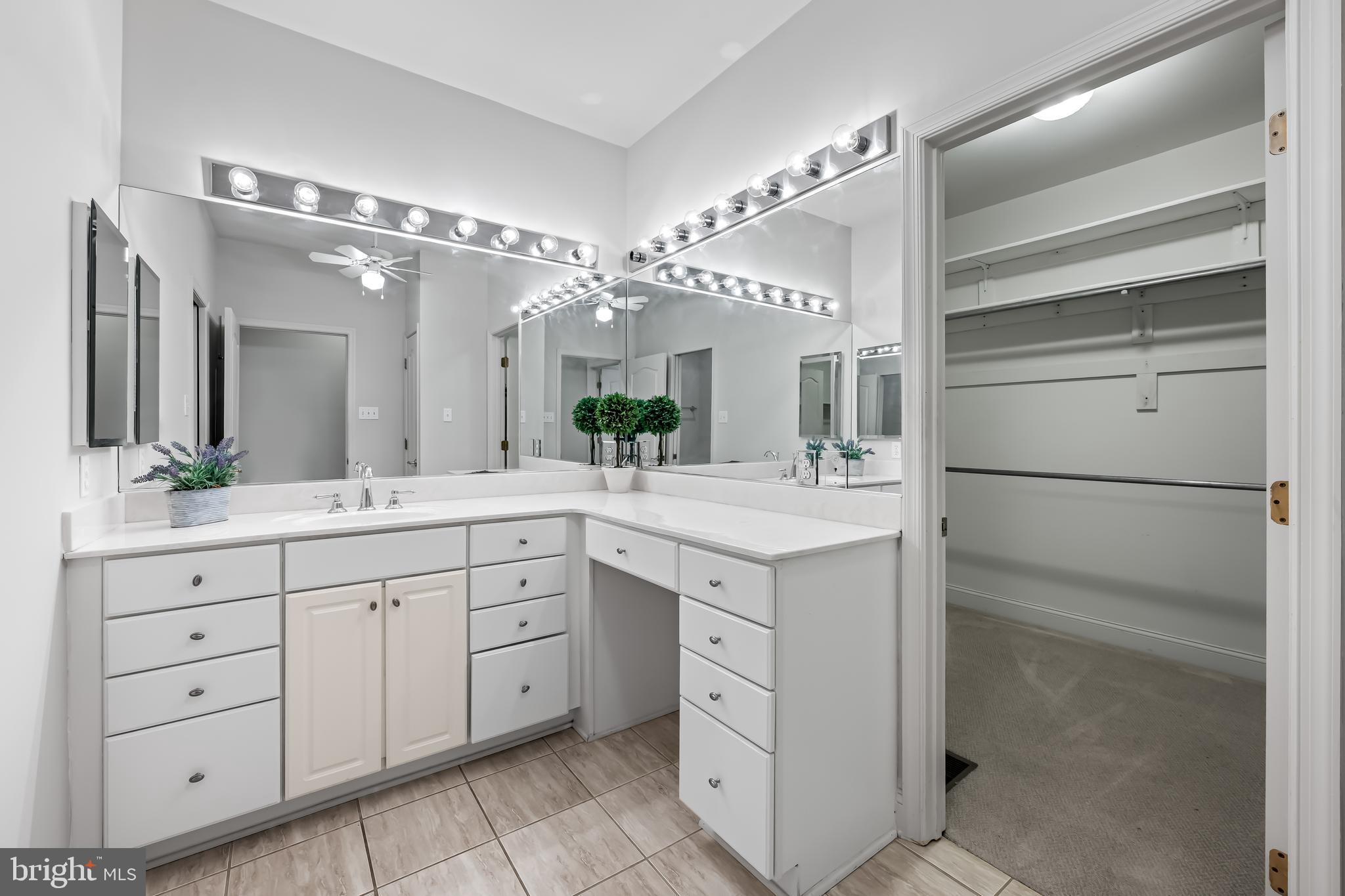 24 Roland Green, Unit 12 Baltimore, MD 21210 - Photo 26 of 53 a spacious bathroom with a double vanity sink and mirror
