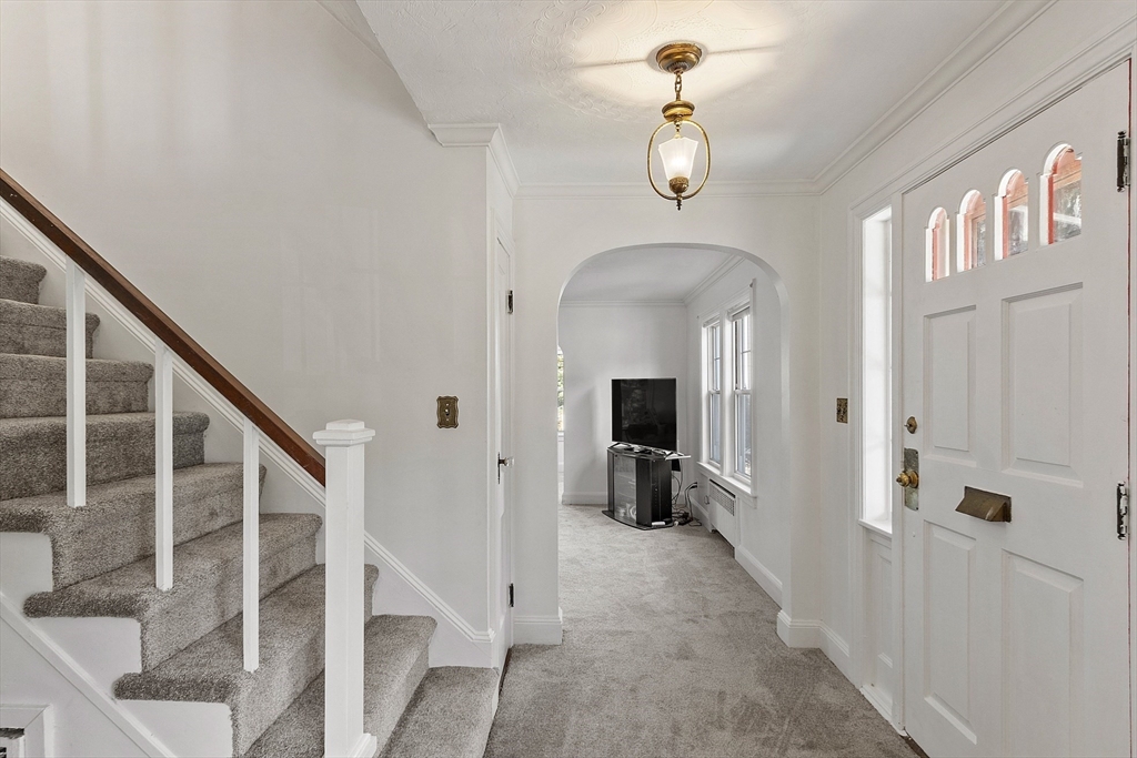256 Massasoit Road Worcester, MA 01604 - Photo 13 of 33 a view of a livingroom with wooden floor and stairs