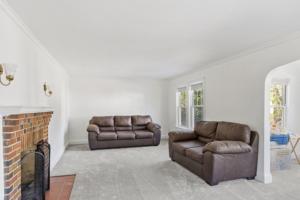 256 Massasoit Road Worcester, MA 01604 - Photo 14 of 33 a living room with furniture a couch and a window