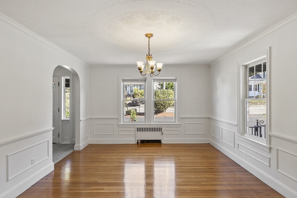 256 Massasoit Road Worcester, MA 01604 - Photo 19 of 33 a view of an empty room with window and wooden floor