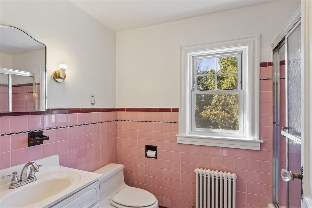 256 Massasoit Road Worcester, MA 01604 - Photo 27 of 33 a bathroom with a sink a toilet and mirror