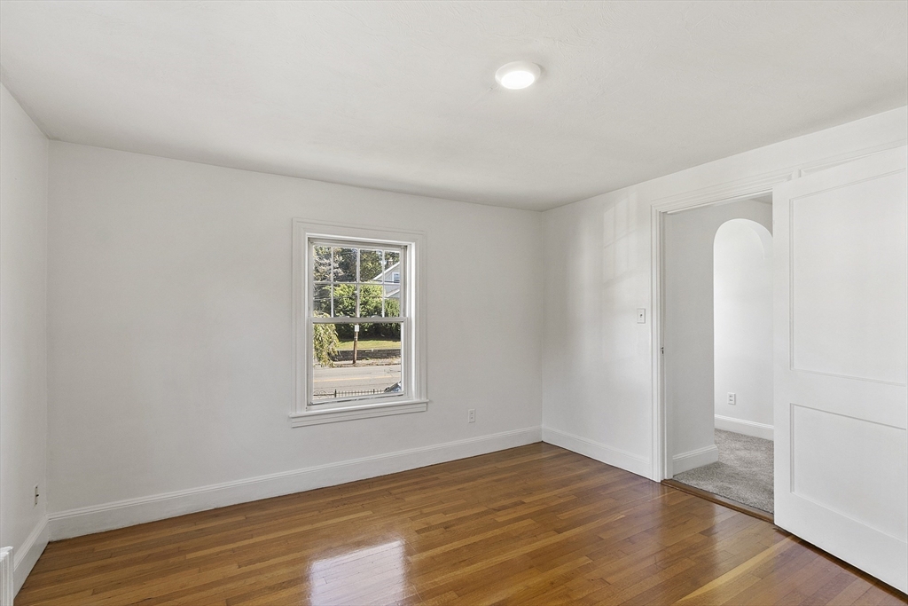256 Massasoit Road Worcester, MA 01604 - Photo 31 of 33 a view of an empty room with wooden floor and a window