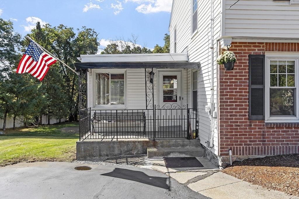 256 Massasoit Road Worcester, MA 01604 - Photo 5 of 33 a view of a house with a patio and a yard