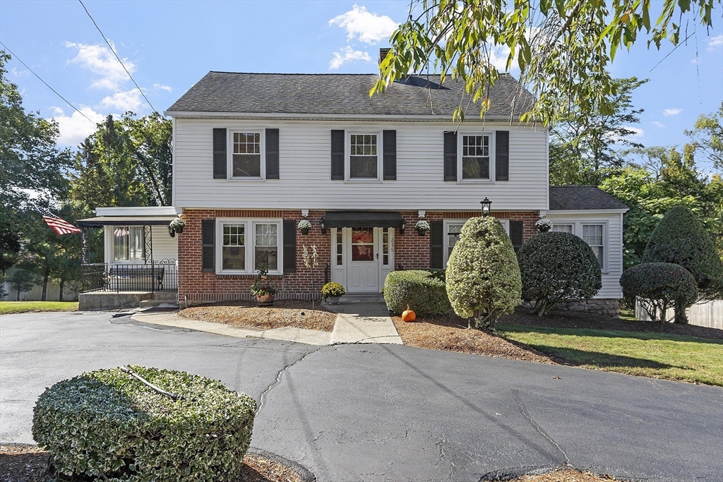 256 Massasoit Road Worcester, MA 01604 - Photo 10 of 33 a front view of a house with garden and parking