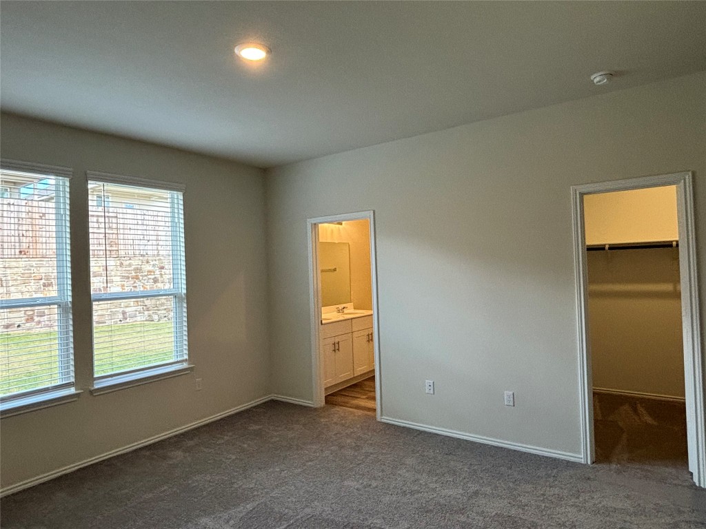 344 Tree Nut Loop Buda, TX 78610 - Photo 13 of 22 an empty room with windows