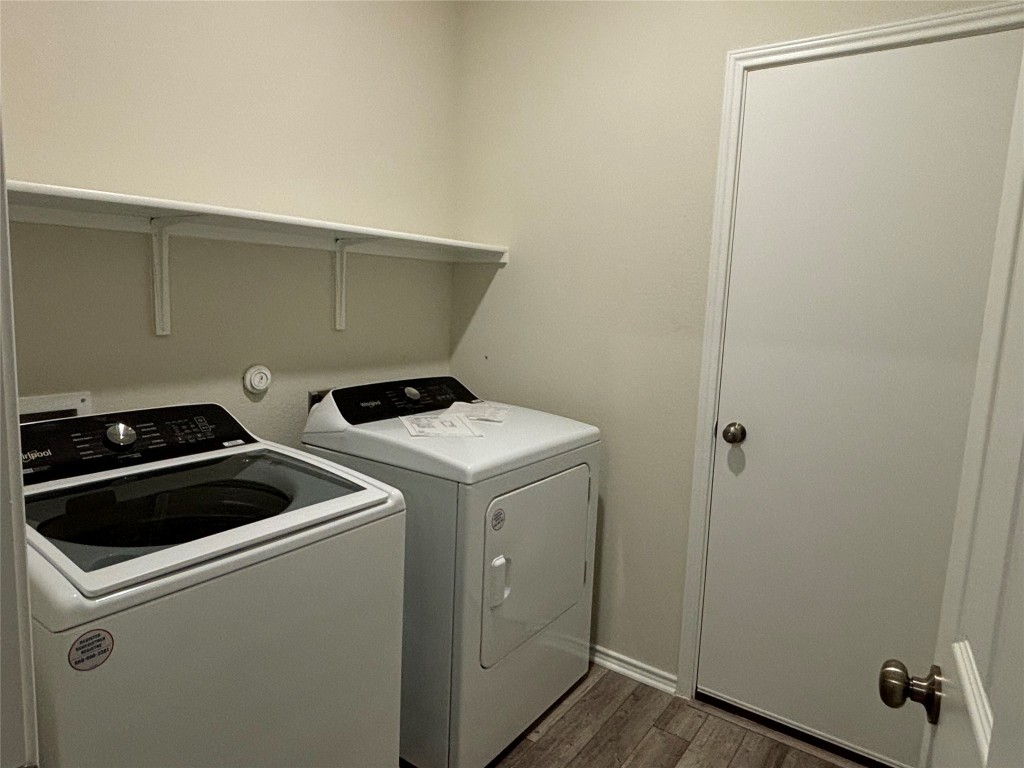 344 Tree Nut Loop Buda, TX 78610 - Photo 19 of 22 a utility room with dryer and washer