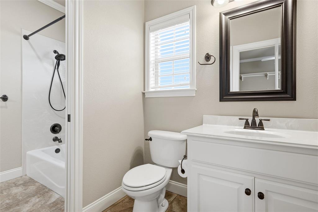 504 Casa Del Rancho Road Lorena, TX 76655 - Photo 20 of 39 a bathroom with a sink toilet and shower
