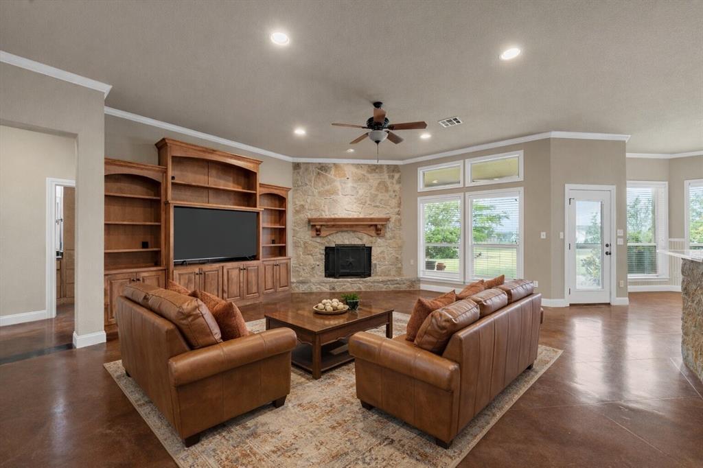 504 Casa Del Rancho Road Lorena, TX 76655 - Photo 3 of 39 a living room with furniture window and a flat screen tv