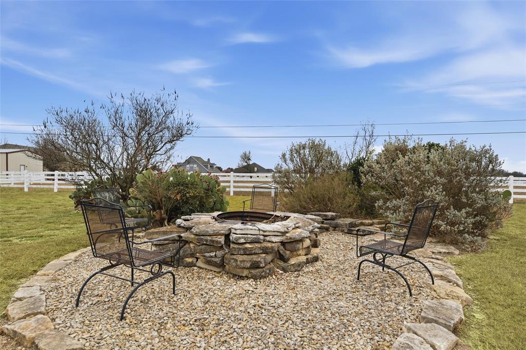 504 Casa Del Rancho Road Lorena, TX 76655 - Photo 31 of 39 a view of a terrace with furniture and garden