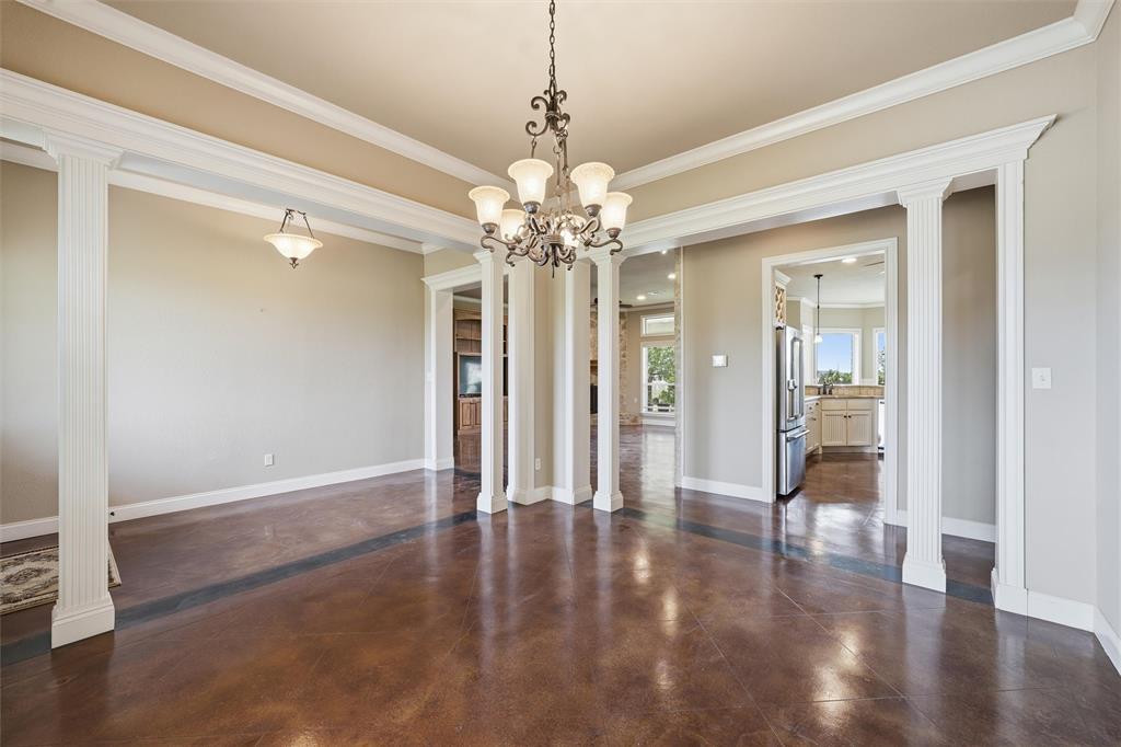 504 Casa Del Rancho Road Lorena, TX 76655 - Photo 6 of 39 a view interior of a house with wooden floor and chandelier