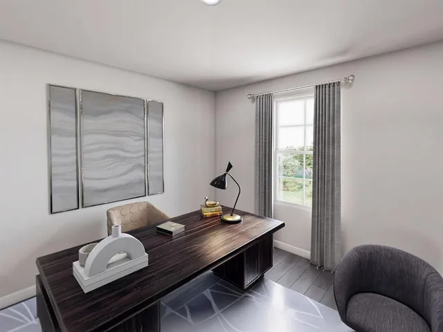 a bedroom with furniture and a flat screen tv