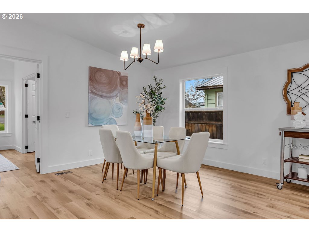 241 Northwest Wade Street Estacada, OR 97023 - Photo 15 of 45 a view of a dining room with furniture and wooden floor