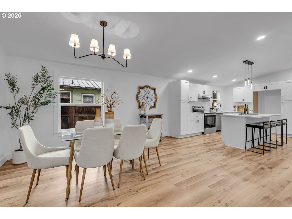 241 Northwest Wade Street Estacada, OR 97023 - Photo 16 of 45 a view of a dining room with furniture and chandelier