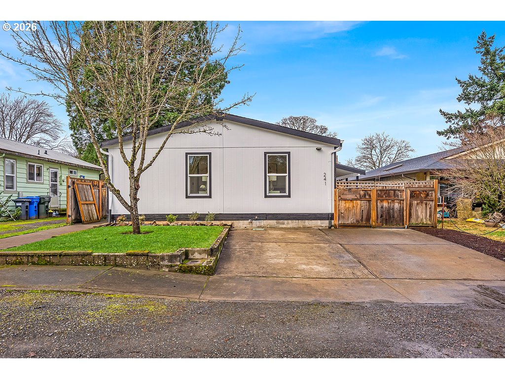 241 Northwest Wade Street Estacada, OR 97023 - Photo 2 of 45 a front view of a house with a yard