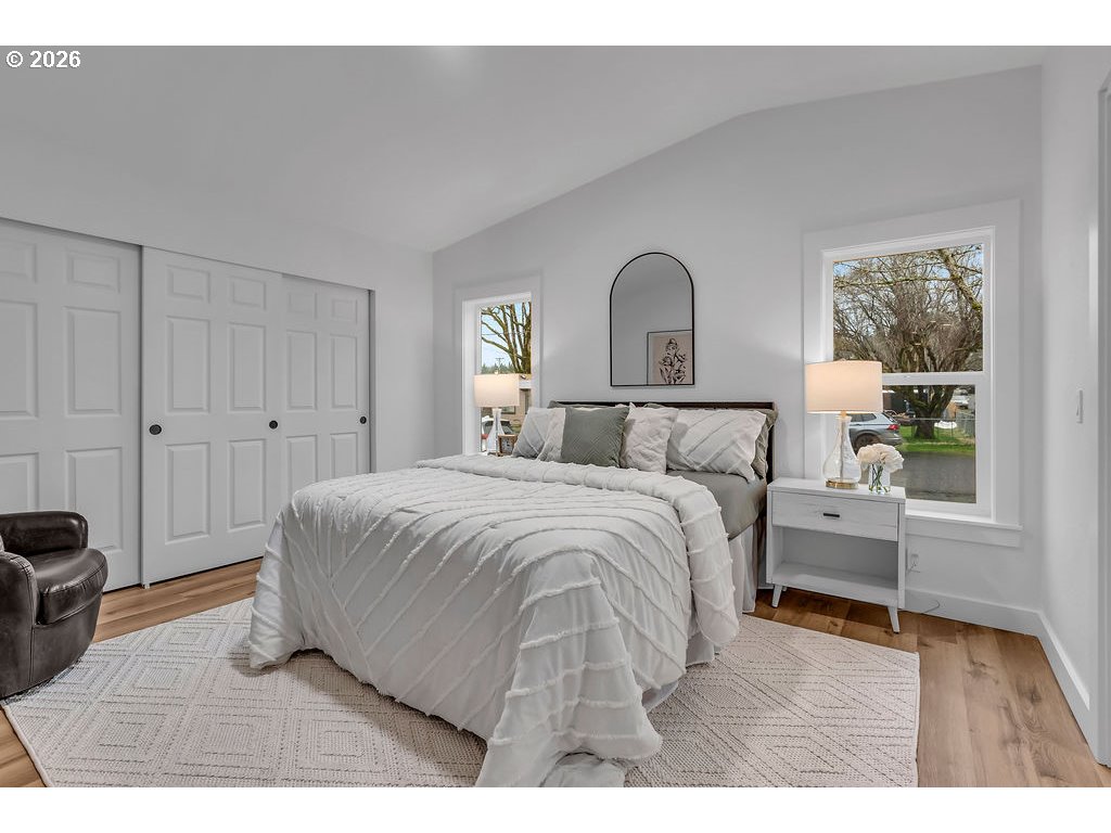 241 Northwest Wade Street Estacada, OR 97023 - Photo 23 of 45 a bedroom with a bed and a window