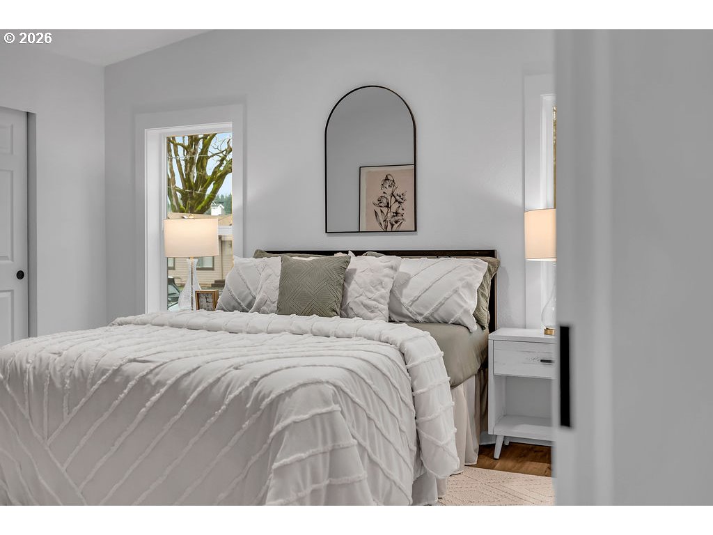 241 Northwest Wade Street Estacada, OR 97023 - Photo 24 of 45 a bedroom with a bed and a painting on the wall