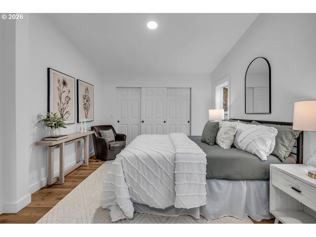 241 Northwest Wade Street Estacada, OR 97023 - Photo 25 of 45 a bedroom with a bed and a potted plant