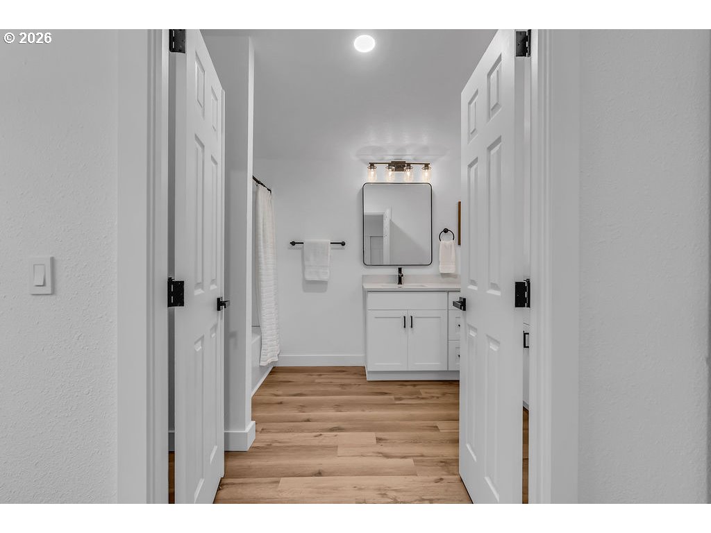 241 Northwest Wade Street Estacada, OR 97023 - Photo 27 of 45 a bathroom with a sink and a mirror
