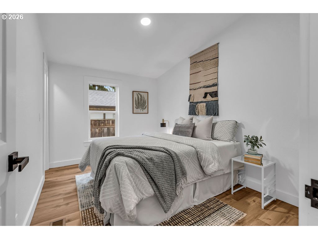 241 Northwest Wade Street Estacada, OR 97023 - Photo 34 of 45 a bedroom with a bed and a table