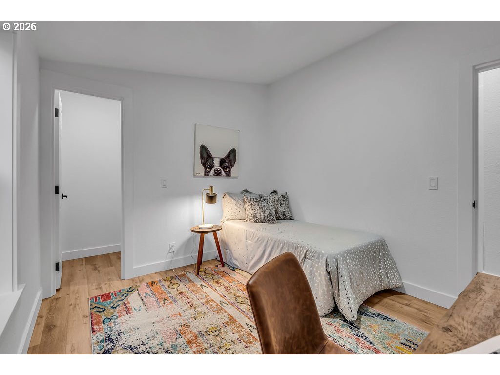 241 Northwest Wade Street Estacada, OR 97023 - Photo 38 of 45 a bedroom with a bed and wooden floor