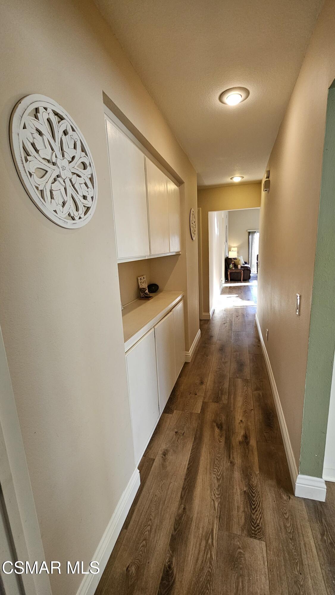 14640 Marymount Street Moorpark, CA 93021 - Photo 30 of 33 a view of a hallway with wooden floor