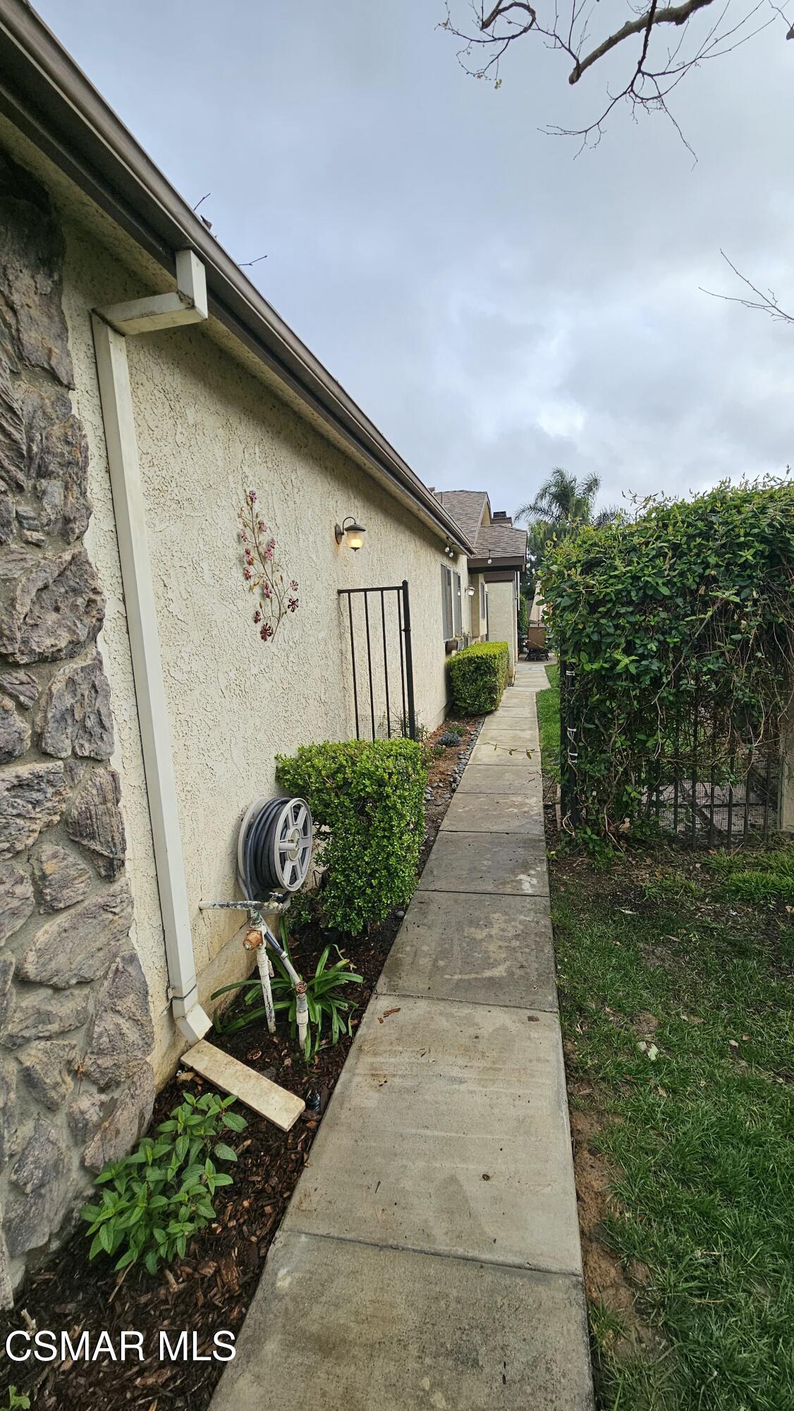 14640 Marymount Street Moorpark, CA 93021 - Photo 4 of 33 a front view of a house with garden