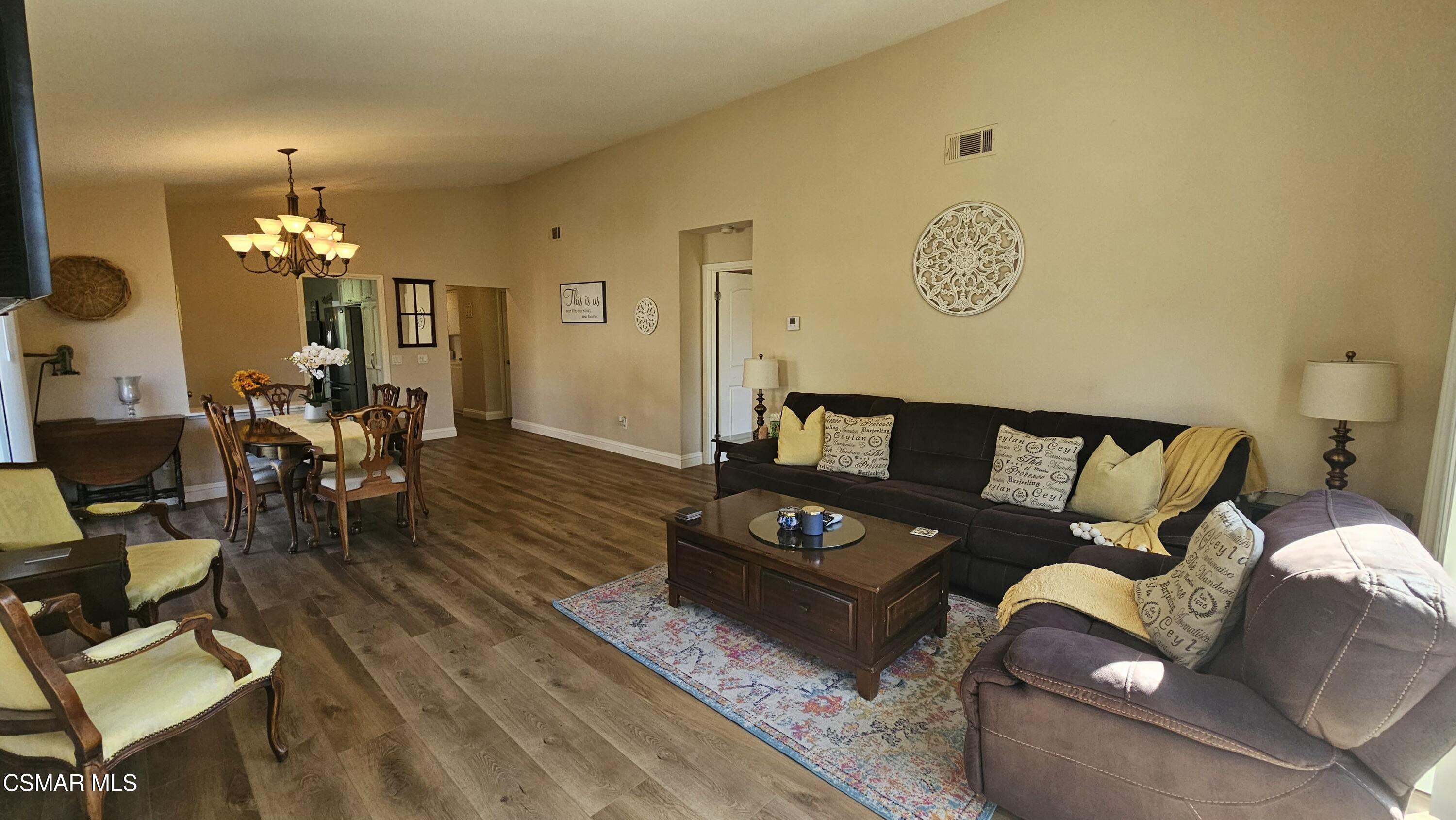 14640 Marymount Street Moorpark, CA 93021 - Photo 7 of 33 a living room with furniture and a chandelier