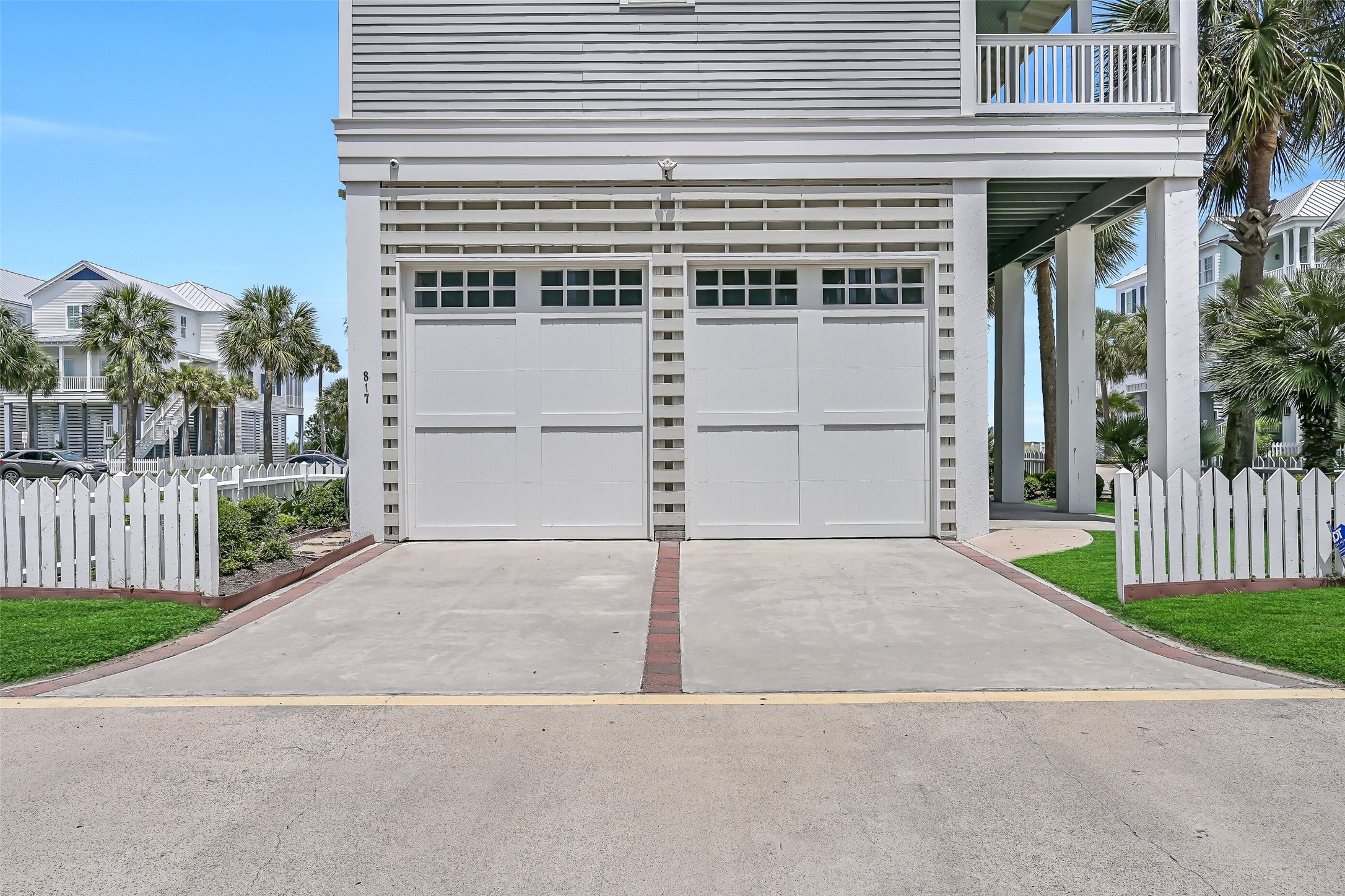 817 Positano Road Galveston, TX 77550 - Photo 47 of 50 The oversized attached garage provides ample room for vehicles, beach gear, bicycles, and additional storage. A spacious driveway offers convenient parking for family and guests.