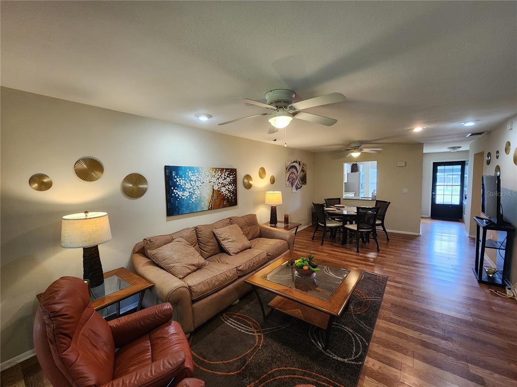 948 North Beneva Road, Unit V25 Sarasota, FL 34232 - Photo 11 of 29 a living room with furniture and wooden floor