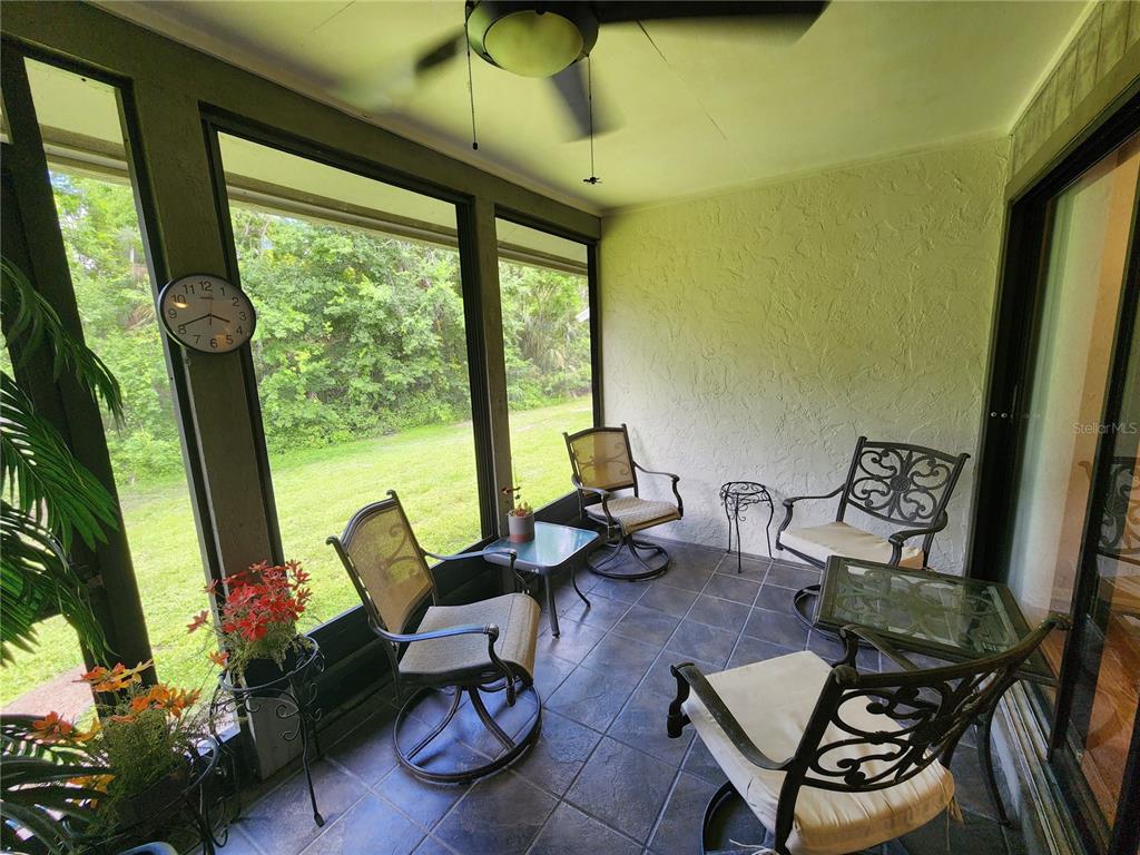 948 North Beneva Road, Unit V25 Sarasota, FL 34232 - Photo 13 of 29 a living room with furniture and a large window