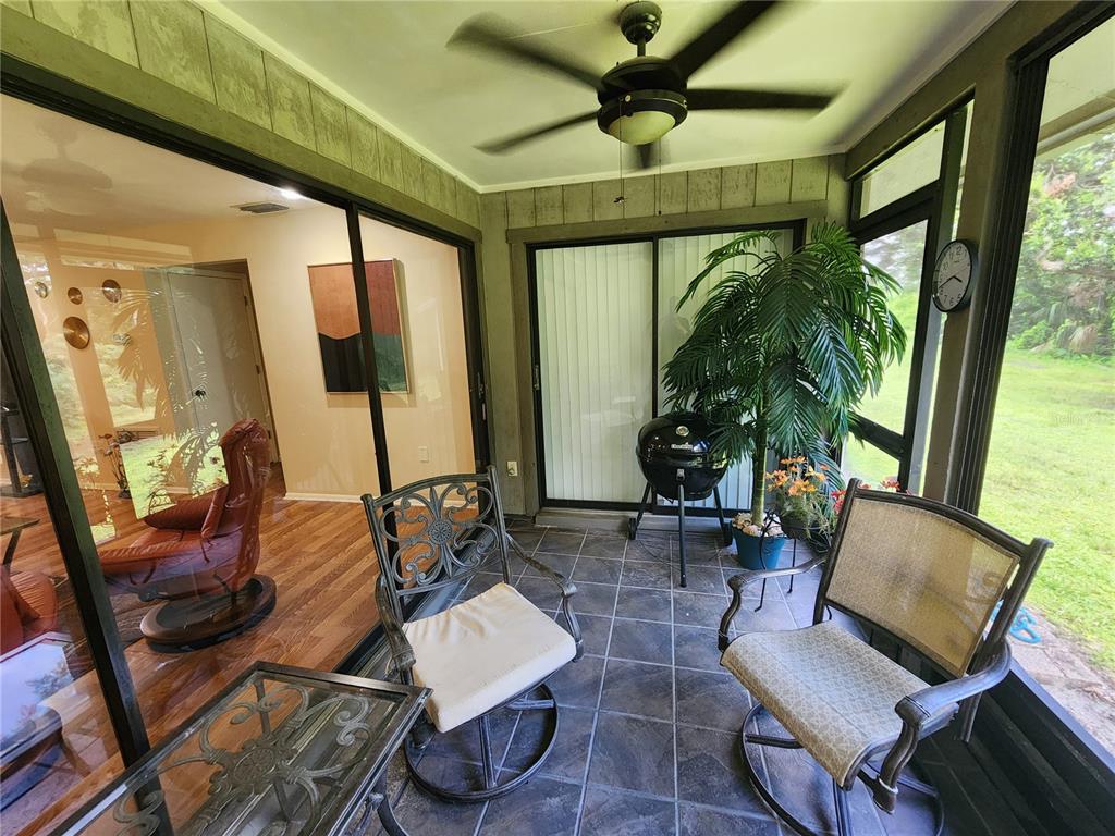 948 North Beneva Road, Unit V25 Sarasota, FL 34232 - Photo 14 of 29 a living room with furniture and a large window