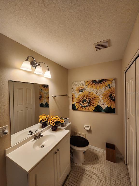 948 North Beneva Road, Unit V25 Sarasota, FL 34232 - Photo 16 of 29 a bathroom with a sink mirror and toilet
