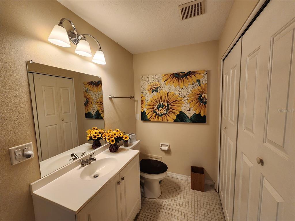 948 North Beneva Road, Unit V25 Sarasota, FL 34232 - Photo 17 of 29 a bathroom with a sink toilet and mirror