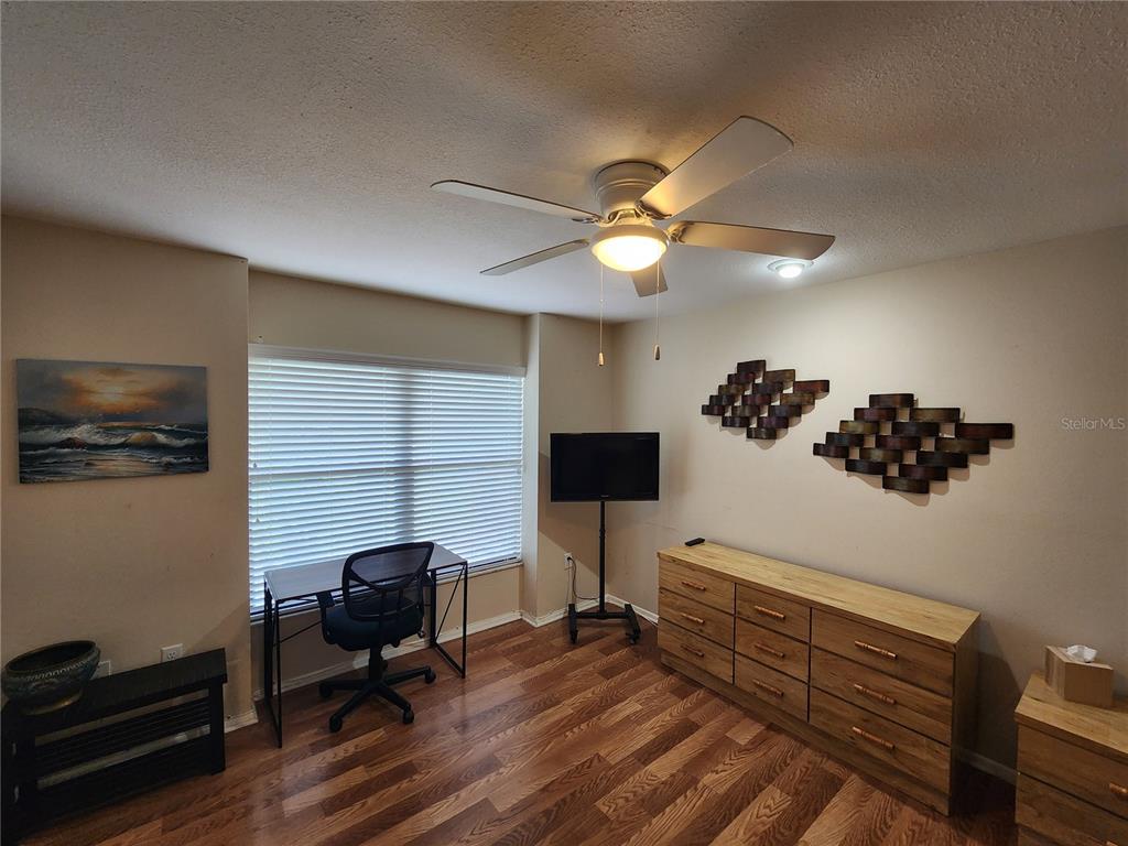 948 North Beneva Road, Unit V25 Sarasota, FL 34232 - Photo 19 of 29 a view of a workspace with furniture and a window