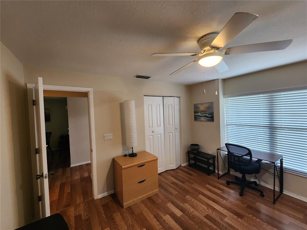 948 North Beneva Road, Unit V25 Sarasota, FL 34232 - Photo 20 of 29 a bedroom with furniture and a window