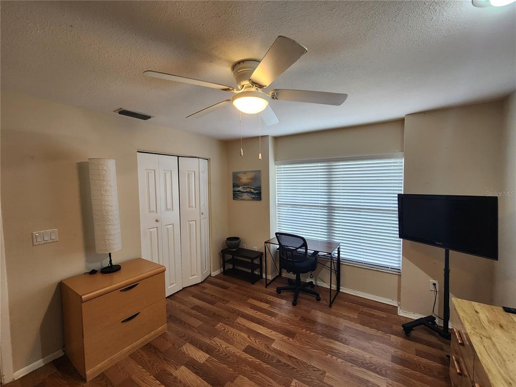 948 North Beneva Road, Unit V25 Sarasota, FL 34232 - Photo 21 of 29 a bedroom with furniture and a window