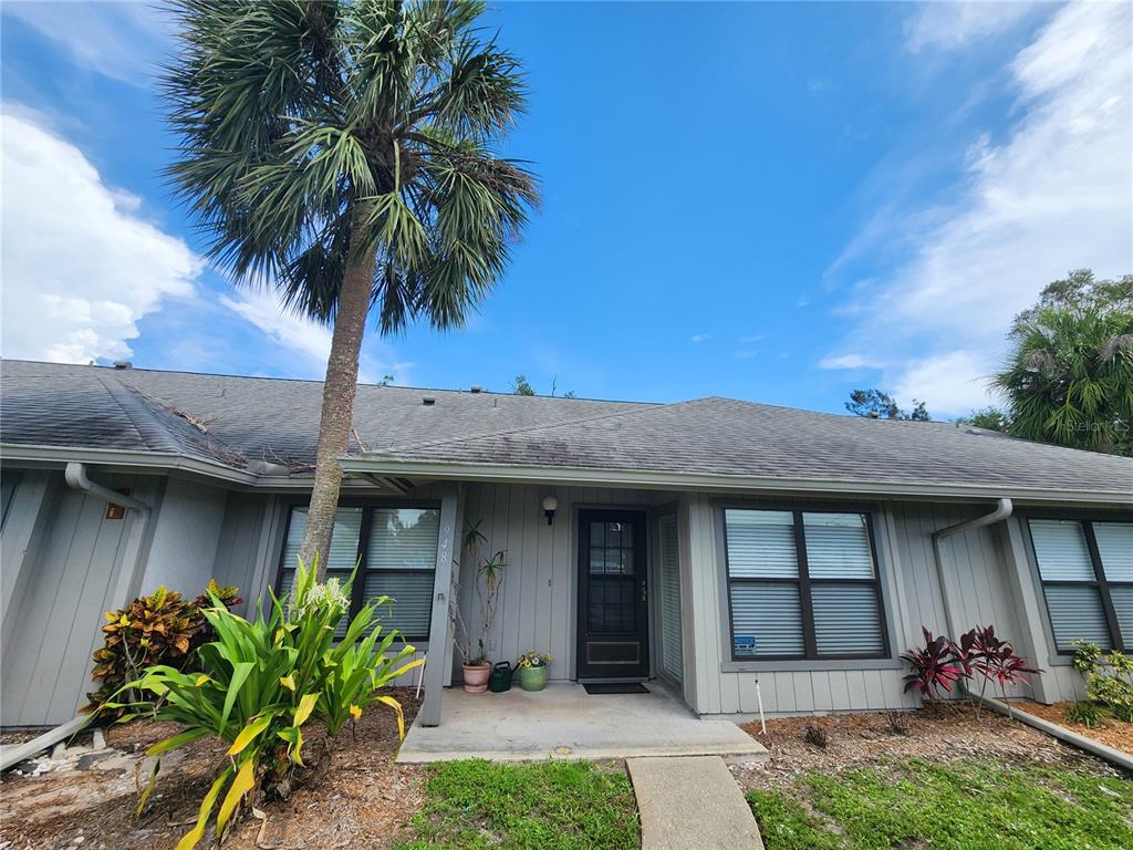 948 North Beneva Road, Unit V25 Sarasota, FL 34232 - Photo 27 of 29 a front view of a house with a garden