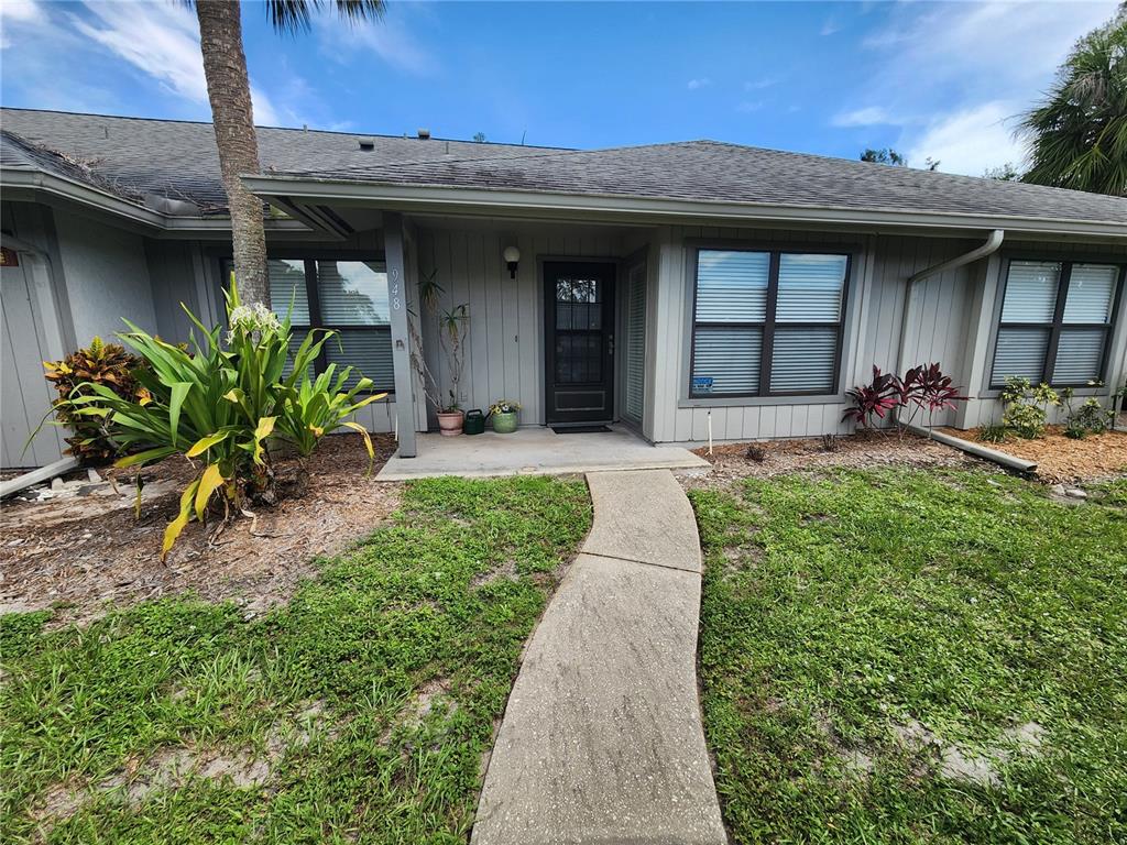 948 North Beneva Road, Unit V25 Sarasota, FL 34232 - Photo 28 of 29 a front view of a house with garden