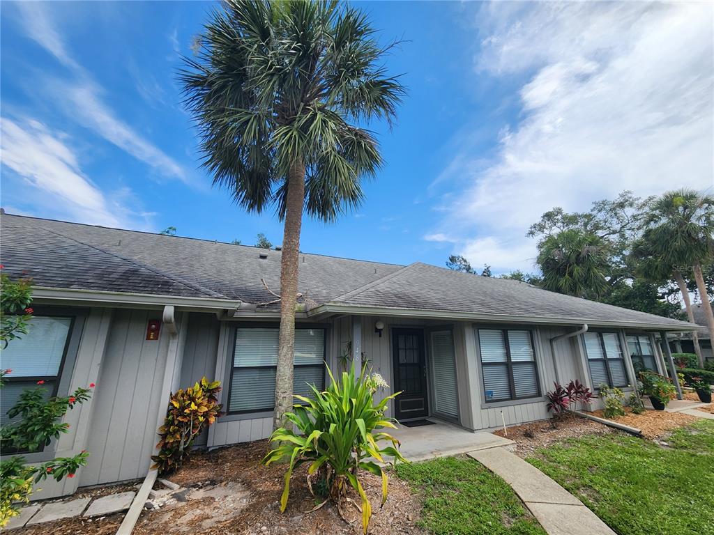 948 North Beneva Road, Unit V25 Sarasota, FL 34232 - Photo 7 of 29 a front view of a house with a garden