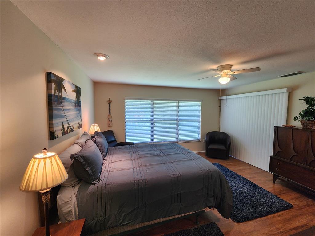 948 North Beneva Road, Unit V25 Sarasota, FL 34232 - Photo 9 of 29 a bedroom with a bed and window