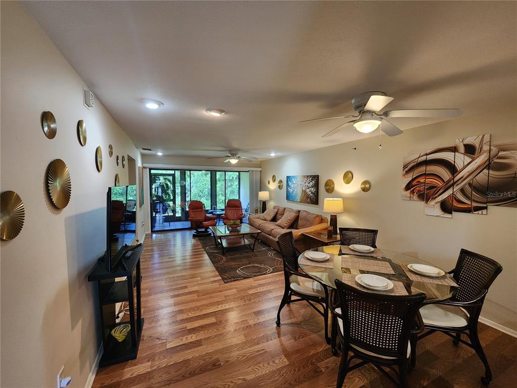948 North Beneva Road, Unit V25 Sarasota, FL 34232 - Photo 10 of 29 a living room with furniture and wooden floor